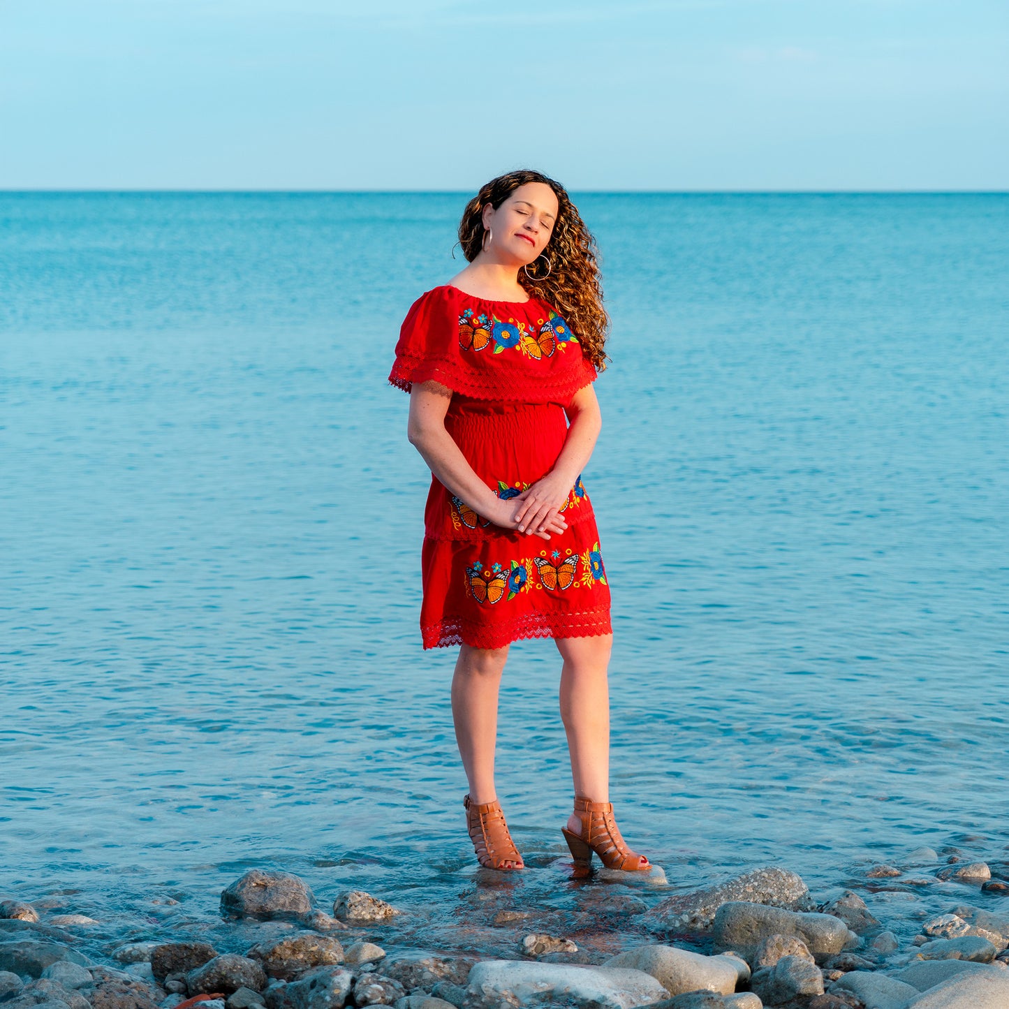 Red off shoulder dress with monarch butterfly embroidery and Mexican artisan floral details